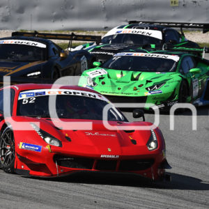 photo of several racing cars competing on a circuit