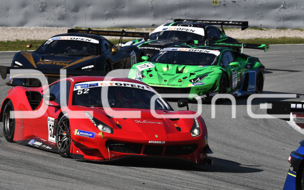 photo of several racing cars competing on a circuit